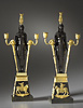 A magnificent pair of Empire gilt and patinated bronze two-light candelabra retour d’Egypte attributed to Pierre-Philippe Thomire after a design by Charles Percier